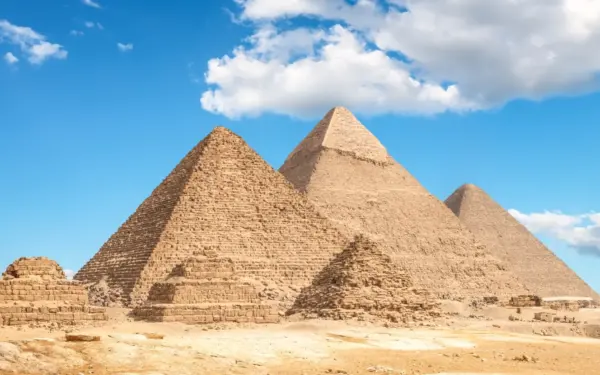 The Giza pyramids seen across Cairo at golden hour