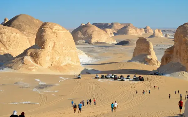 Four-wheel-drive vehicles among the chalk formations of the White Desert