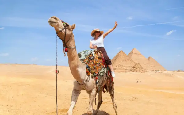 A licensed local guide with a small private group at Giza